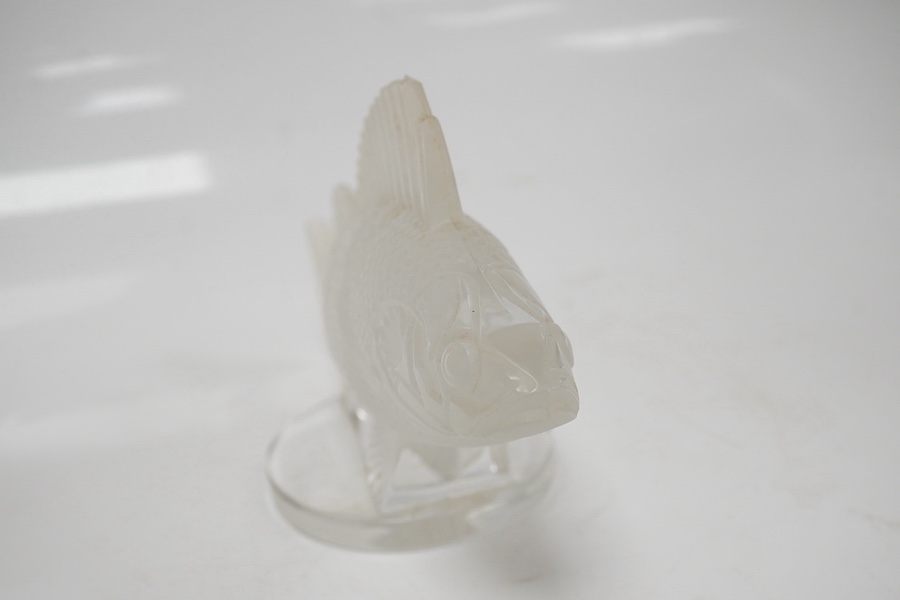 A modern Lalique glass paperweight in the form of a fish, signed to the base, 16cm wide. Condition - good